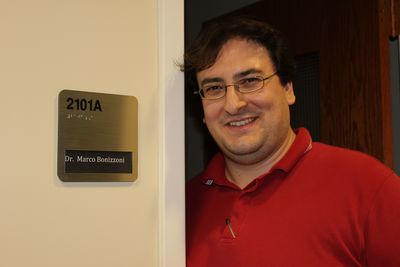 Dr. Marco Bonizzoni in front of his new office.